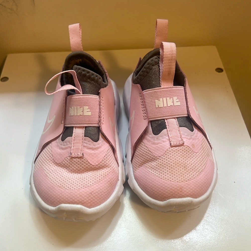 Pink Nike slip ons